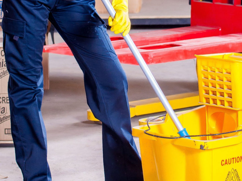 Commercial cleaning maid services frederick md mopping a shop floor